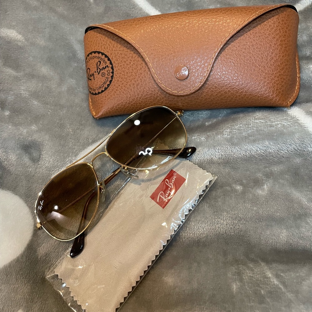 Gold framed ray bans with brown lens